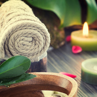 Botanical Green Lab spa accessories including towels, sponges, and combs for a natural, luxurious home spa experience